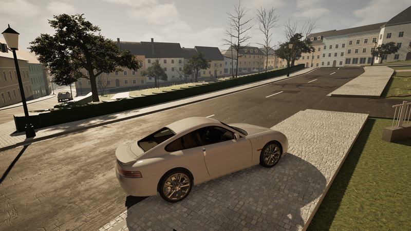 Weißer Sportwagen am Straßenrand, Blick über die Stadt bei Tag